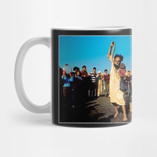 Man in Souk with Snake in Hand, Owl on Shoulder, Scorpion on Nostril Mug